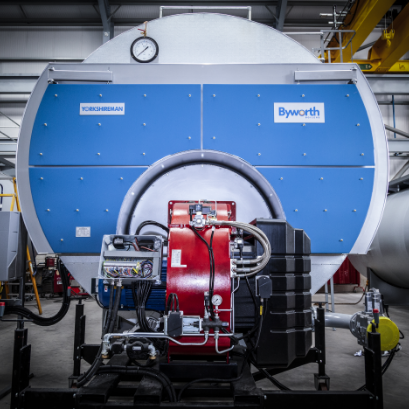front end view of an industrial boiler with blue heat shields and a red burner